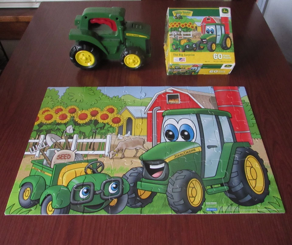 John Deere 60 piece puzzle The Big Surprise plus John Deer Flashlight - Image 1 of 4