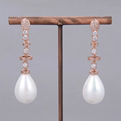 Серьги-цепочки из натурального белого каплевидного морского жемчуга с покрытием из розового золота для леди - Изображение 1 из 4