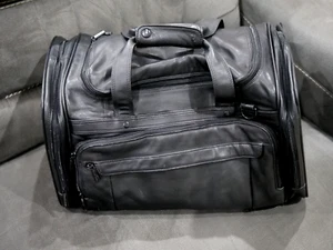 BROOKSTONE LEATHER DUFFLE BAG "THE MIRAGE HOTEL TREASURE ISLAND EXPANDABLE" 20" - Picture 1 of 7