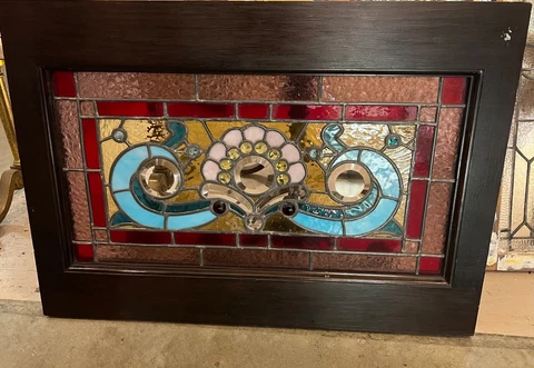 Matched pair of jeweled and beveled stained glass windows Cover