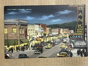 Postcard Medford OR Oregon Main Street Downtown Night View Drug Store Bank - Picture 1 of 2