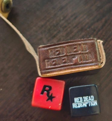 Red Dead Redemption 2 谎言骰子视频游戏罕见收藏促销带盒 — 第 1/4 张图片