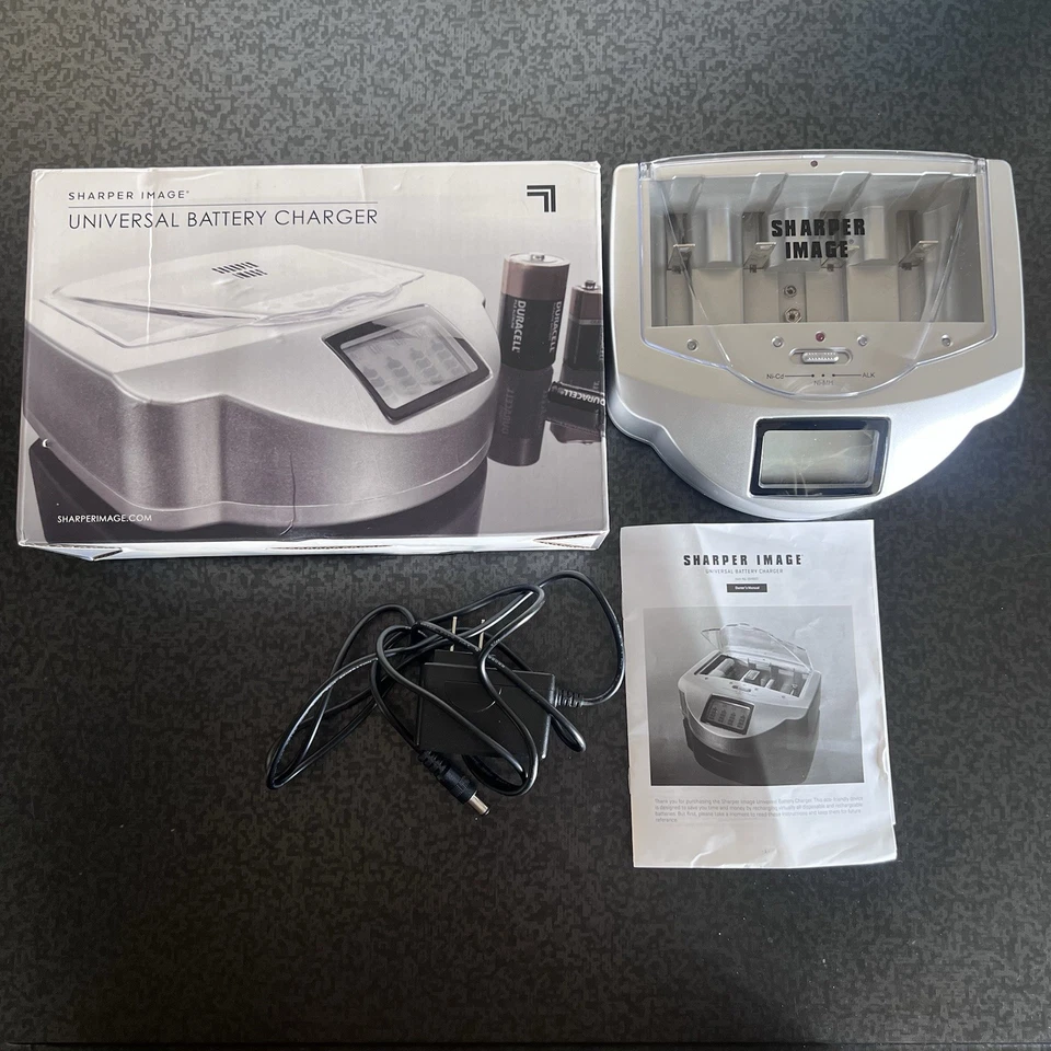 Cargador de batería universal plateado Sharper Image Foto 1 de 4