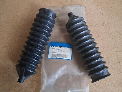 MAZDA 323 BF BW 626 GC -87 PAR DE BOTAS DE SELLO DE CREMALLERA DE DIRECCIÓN 2 piezas GENUINAS Foto 1 de 4