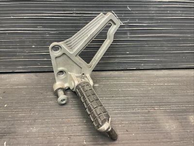 1997 Kawasaki Ninja 250R EX250R Left front foot peg and bracket #515245 - Image 1 of 4