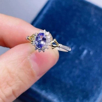 Anillo de compromiso de tanzanita enchapado en oro blanco de 14 quilates de corte ovalado de 2 quilates creado en laboratorio Foto 1 de 4