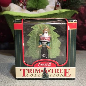 Coca-Cola Ornament Trim a Tree 1999 Elf Sitting on a Coca-Cola Bottle & Opener - Picture 1 of 8