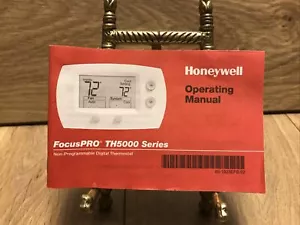 Honeywell FocusPRO TH5000 Series Operating Manual English, French, & Spanish - Picture 1 of 5