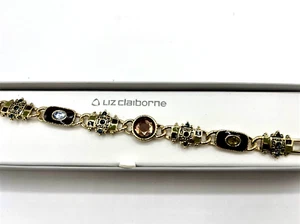 Pulsera Liz Claiborne, eslabones esmaltados en tono dorado con piedras multicolores. 7" - Imagen 1 de 4