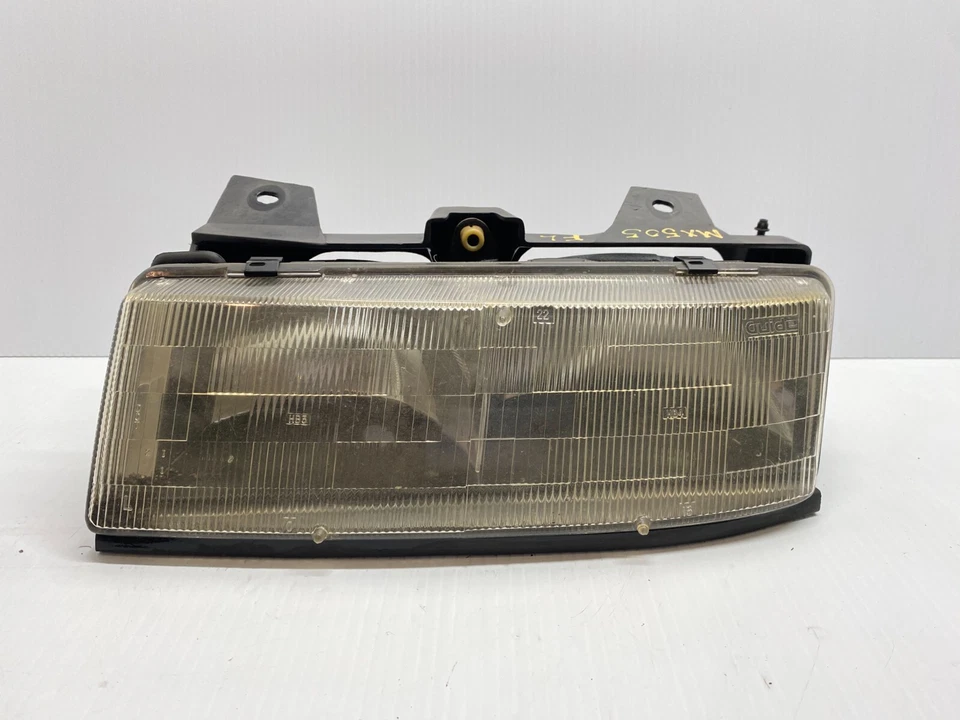 FARO IZQUIERDO CHEVROLET CORSICA 1990-1996 - OEM 114-00183CL Foto 1 de 4