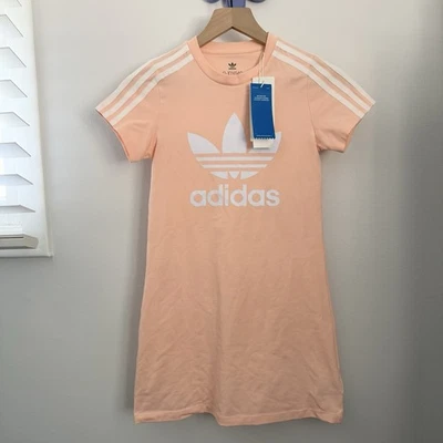 Adidas 9-10 Años NUEVO Vestido Naranja Melocotón Manga Corta Logo Estampado Exterior Pastel Foto 1 de 4
