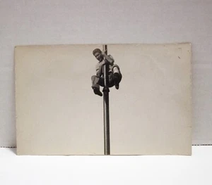 Man Sliding Down Flagpole Postcard Novelty Unposted B&W RPPC AZO @1904-1918 - Picture 1 of 2