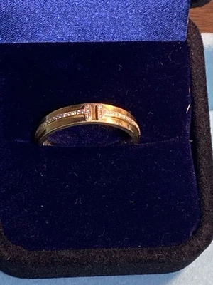 Anillo Tiffany & Co. de oro amarillo de 18 quilates y diamantes banda ancha en T Foto 1 de 4