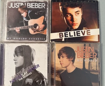 JUSTIN BIEBER 4CD Lot. My World, Worlds Acoustic, Never Say Never, & Believe - Image 1 of 4