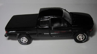 Camión Johnny Lightning Dodge Ram parte de la serie pilotos reales negro único Foto 1 de 3