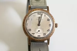 MONTRE-JYB MECANIQUE 1960-BRACELET GRIS-3,5CM RONDE--mauvais état - Imagen 1 de 2