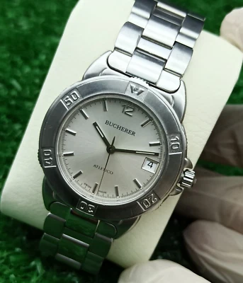 РОСКОШНЫЙ BUCHERER ATLETICO СЕРЕБРЯНЫЕ ЧАСЫ УДИВИТЕЛЬНЫЙ КРУГЛЫЙ ЦИФЕРБЛАТ ШВЕЙЦАРСКИЙ СДЕЛАНО 80-х РЕДКАЯ - Изображение 1 из 4