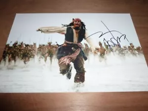 JOHNNY DEPP signed 12X8 photo PIRATES OF THE CARIBBEAN + COA - Picture 1 of 2
