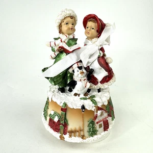 Musikalisches Aufziehkarussell spielt "We Wish You a Merry Christmas" Carolers Pinguin - Bild 1 von 9
