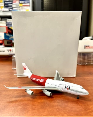 Japan Air Lines Boeing 747-400 Dragon Wings 1:400 REG: JA8915 with 100th banner - Image 1 of 4