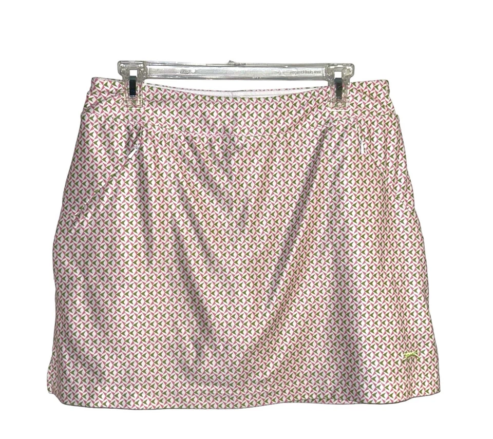Falda corta Slazenger blanca y rosa geométrica de golf con bolsillos para mujer talla mediana Foto 1 de 4