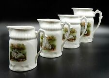 ANTIQUE SET OF 4 CERAMIC PORCELAIN PITCHERS OF 4 DIFFERENT SIZES WITH SWAN ART