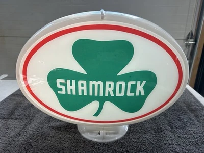 Letrero globo terráqueo bomba gasolina trébol Foto 1 de 4