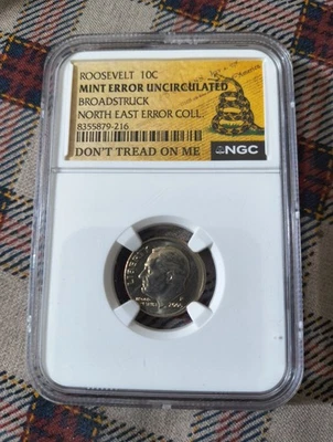Roosevelt 10C Mint Error – Broad struck – NGC - Don't Tread On Me Label Toned - Image 1 of 4