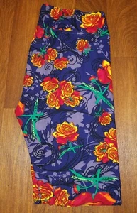 NEU OHNE ETIKETT LULAROE TC LEGGINGS DISNEY ROSEN ORANGE LILA GEBLÜMT - Bild 1 von 3