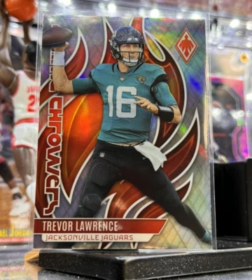 2023 PANINI PHOENIX TREVOR LAWRENCE FLAME THROWERS SILVER JAGUARS HOLO - Image 1 of 4