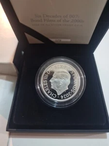 Royal Mint 2024 SIX DECADES OF 007 BOND FILMS 2OZ SILVER PROOF COIN - Picture 1 of 5