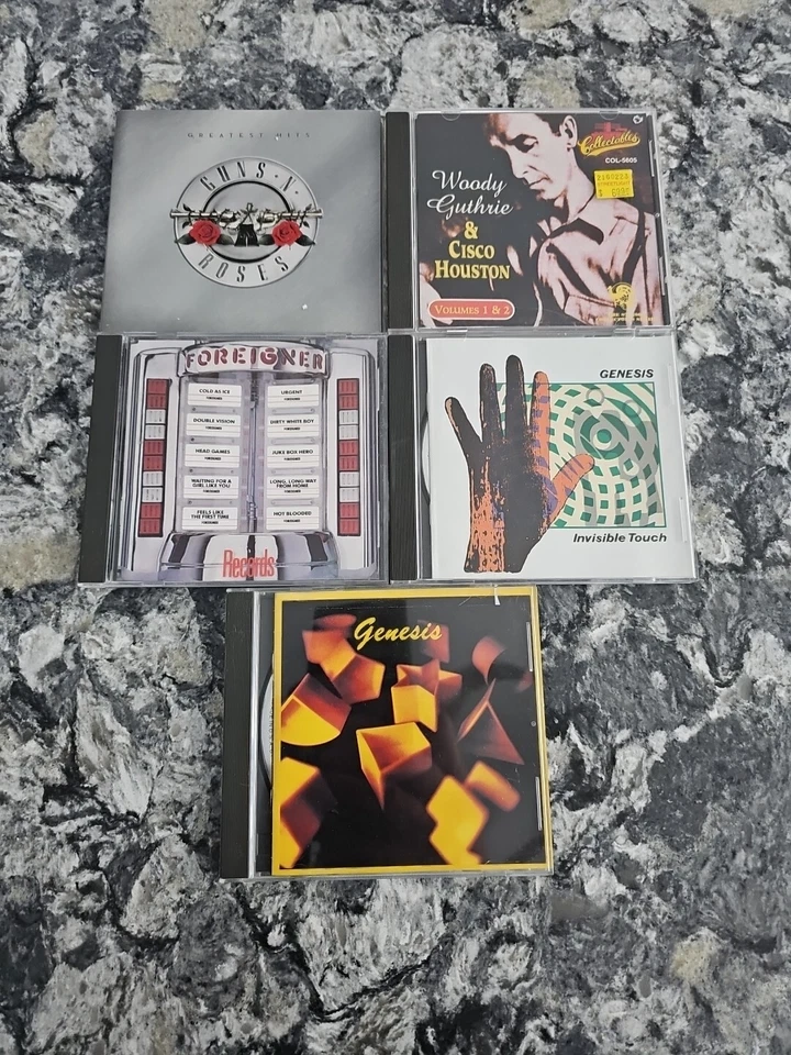 lot of 5 Rock/Jazz/Blues CDs Guns Roses Woody Guthrie Foreigner Genesis Foto 1 de 2