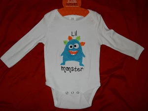NUEVO CON ETIQUETAS ~ Body Little Wishes Baby Blanco "Lil Monster" ~ Talla 6-12 ~ Precio de venta sugerido por el fabricante $17.99. - Imagen 1 de 2