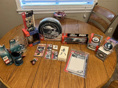 20 Assorted Philadelphia Eagles Items Like Puzzle, Ornaments, Truck, & Key Chain Cover