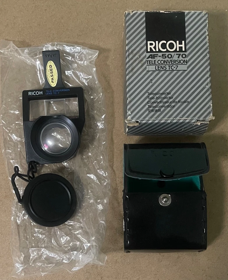 Lente de teleconversión Ricoh de colección RICOH TC-7 AF 50/70 NUEVO STOCK ANTIGUO en estuche y caja Foto 1 de 4