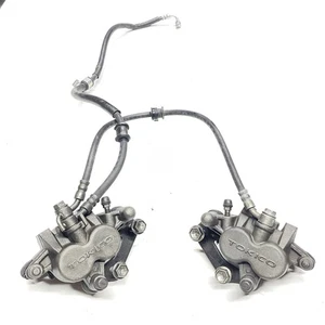 15-22 JUEGO PINZAS FRENO DELANTERO DERECHO IZQUIERDO SUZUKI GSXS750 PAR PINZAS CON LÍNEAS - Imagen 1 de 10