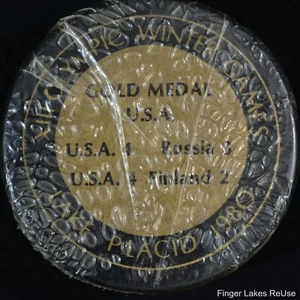 1980 Lake Placid Olympic Gold Medal Commemorative Hockey Puck Sealed - Picture 1 of 3