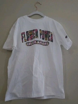 Camiseta Flower Power Naciones Unidas, NUEVA sin etiquetas 100% algodón YM 7-8 Foto 1 de 2