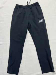 Pantalones de correr New Balance negros para hombre bolsillo cargo talla pequeña. 3 I - Imagen 1 de 8