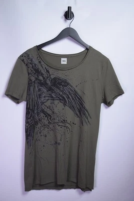 Camiseta Relaxed Fit con Estampado Grunge Cuervo en Verde Oliva Foto 1 de 4