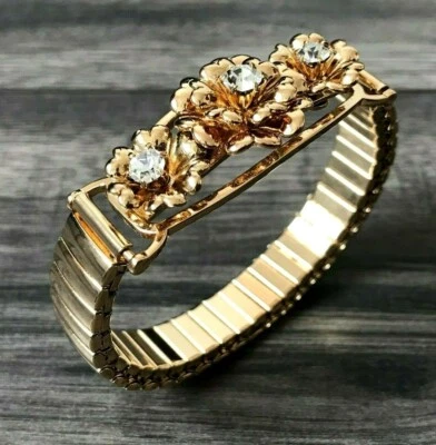 DANNIJO Goldfarbene Verzierte Armbanduhr & Logo Tasche Einzelhandel £170 - Bild 1 von 4