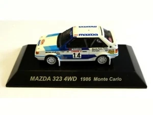 WOW EXTREMADAMENTE RARO Mazda 323 4x4 Turbo #14 M.Carlo 1986 WRC 1:64 CM's Kyosho-RX7 - Imagen 1 de 3