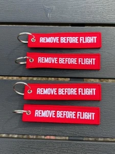 Remove before Flight Schlüsselanhänger gestickt 4 Stück NEU - Bild 1 von 1