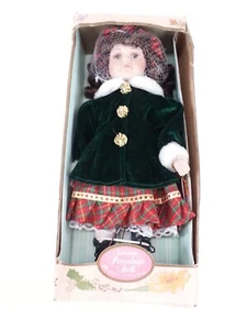 Muñeca de porcelana navideña con cabello ondulado moreno vestido navideño de colección Kingstate - Imagen 1 de 9