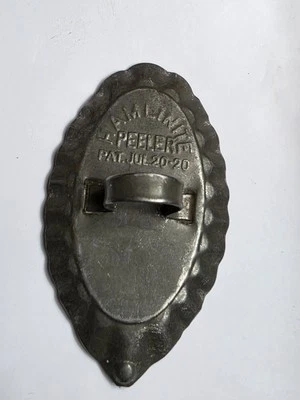 Antique Hamlinite potato peeler kitchen tool tin & stone pat pend - Image 1 of 3