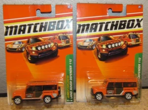 Lot of 2 - 2009 Matchbox Land Rover Defender 110 Diecast Car Truck Orange - Picture 1 of 1