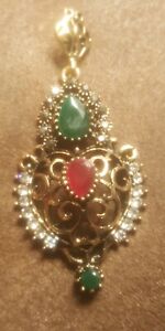 Brass Colored Metal Pendant And Earrings Set With Ruby And Emerald Colored Faux 