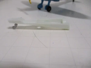 DINKY TOYS REPLACEMENT REAR FUSELAGE BATTERY COVER AND TAIL WHEEL #719 SPITFIRE - Picture 1 of 4