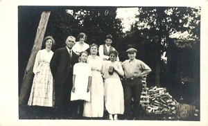 Large Family Outside By Woodpile Daughter Has Brownie Camera Real Photo Postcard - Picture 1 of 2