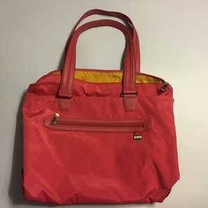 tumi red bag